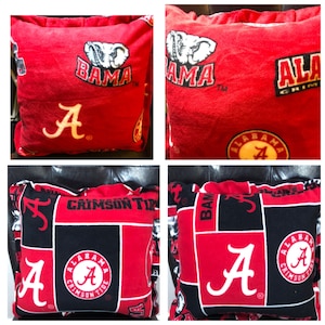 May include: Four different red and black patterned throw pillows with the Alabama Crimson Tide logo and the letter "A".