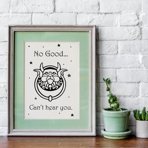 May include: A framed print with a green mat and a white background. The print features a black and white illustration of a knocker with a face and the text "No Good... Can't hear you."