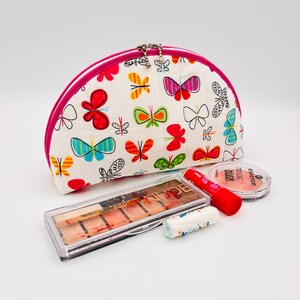 Borsa cosmetica bianca con farfalle colorate