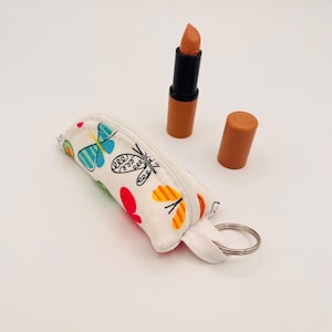 Kleine weiße Tasche Schmetterlinge für Lippenstift Schlüsselanhänger