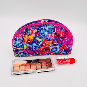 Borsa cosmetica colorata rosa blu con schizzi di cotone