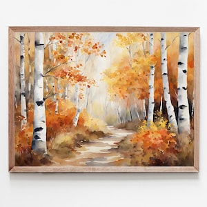 Peut inclure: Une peinture à l'aquarelle encadrée d'une scène de forêt automnale. Des bouleaux blancs avec des marques noires bordent un chemin, entourés de feuillage orange et jaune. L'œuvre est dans un cadre en bois brun clair.