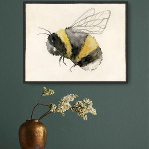 May include: A watercolor painting of a bumblebee with black and yellow stripes and translucent wings. The bee is flying in a white frame against a white background.