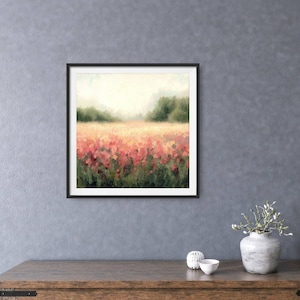 May include: A framed painting of a field of pink flowers with a blurred background of trees and a hazy sky.