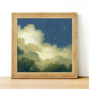 May include: A framed painting of a night sky with clouds and stars. The clouds are a soft yellow and white, and the sky is a deep blue. The stars are small and white.
