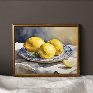May include: Watercolor painting of three yellow lemons on a blue and white patterned plate. The lemons are arranged in a cluster, with one lemon slightly overlapping the others. The plate is sitting on a white tablecloth.