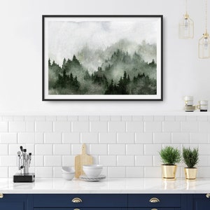 May include: A watercolour painting of a misty forest scene with dark green trees and a light grey background.