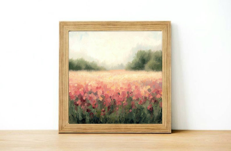 May include: A framed painting of a field of pink flowers with a blurred background of trees and a hazy sky.