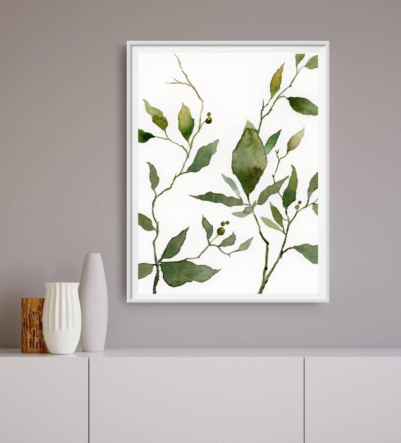 Puede incluir: Una pintura de acuarela de hojas verdes y ramas sobre un fondo blanco. Las hojas est&aacute;n pintadas en tonos de verde, con algunas hojas que tienen un color verde m&aacute;s vibrante que otras. Las ramas son delgadas y delicadas, y est&aacute;n dispuestas de una manera que crea una sensaci&oacute;n de movimiento y flujo.