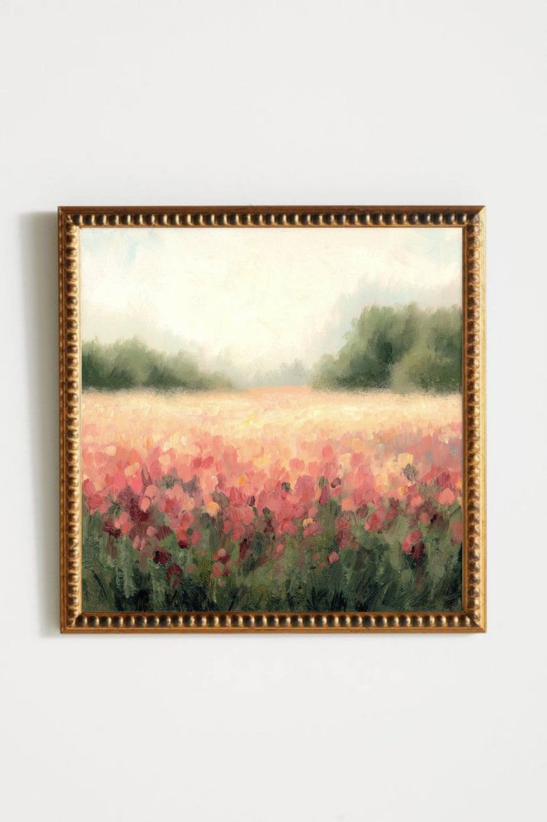 May include: A framed painting of a field of pink flowers with a blurred background of green trees and a light blue sky.