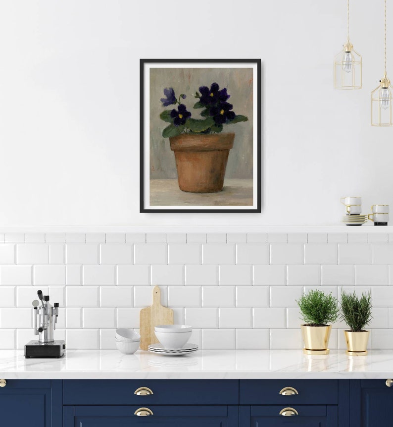 May include: A painting of a potted purple African violet plant with yellow centers. The plant is in a terracotta pot and is sitting on a light gray surface.