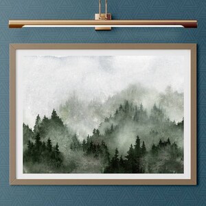 May include: A watercolour painting of a misty forest scene with dark green trees and a light grey background.