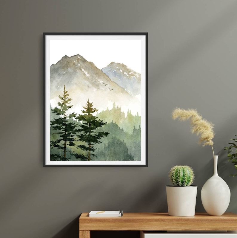 May include: A watercolor painting of a mountain landscape with two pine trees in the foreground and a misty mountain range in the background.