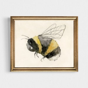 May include: A watercolor painting of a bumblebee with black and yellow stripes, a gray head, and transparent wings. The bee is in flight and is painted on a white background.