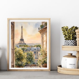 K&ouml;nnte beinhalten: Aquarellgem&auml;lde eines Pariser Balkons mit Blick auf den Eiffelturm. Das Gem&auml;lde ist in einem hellen Holzrahmen gerahmt und vor einer wei&szlig;en Wand platziert.