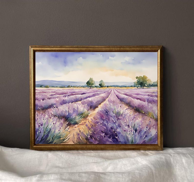 May include: A watercolor painting of a lavender field in Provence, France. The painting depicts a field of purple lavender flowers with a dirt path leading through the center. The sky is blue with white clouds and the sun is shining.