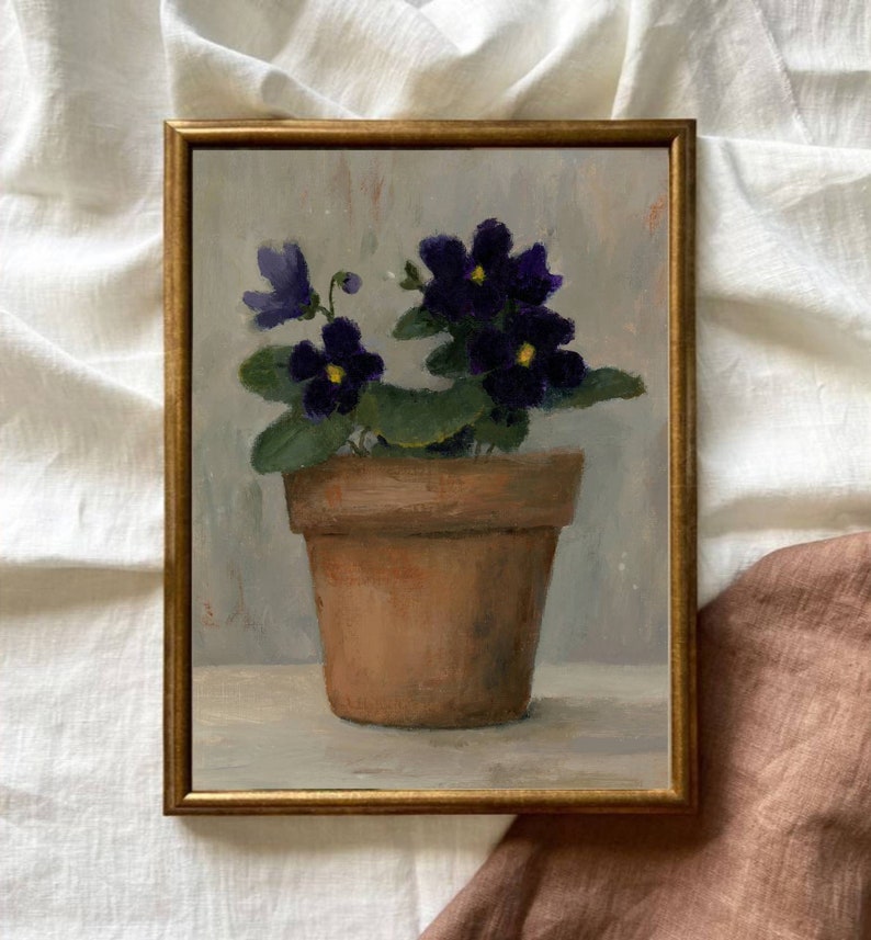May include: A painting of a potted violet plant with purple flowers in a terracotta pot. The plant is sitting on a white surface with a light gray background.