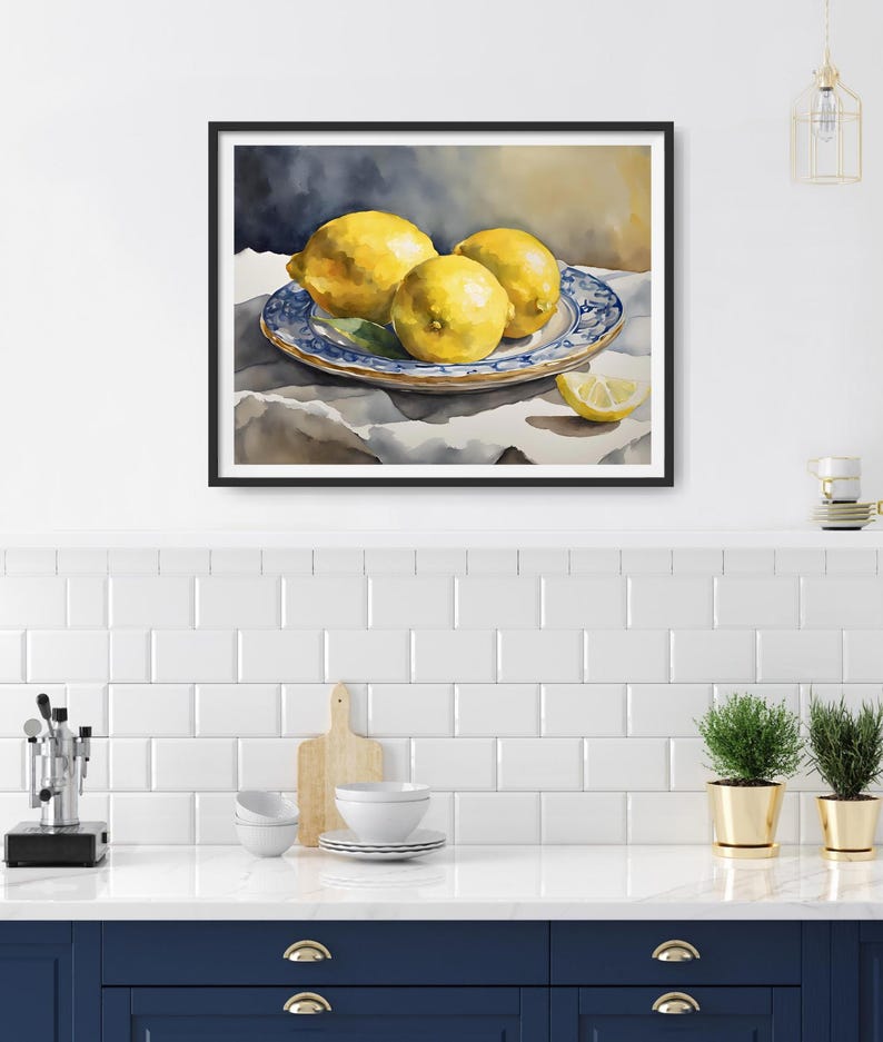 May include: A watercolor painting of three yellow lemons on a blue and white patterned plate. The lemons are arranged in a cluster, with one lemon partially cut in half. The plate is on a white linen tablecloth.