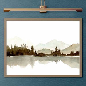 May include: A watercolour painting depicting a mountain lake scene with a forest of trees reflected in the water. The mountains are in the background and are painted in shades of blue and grey. The trees are in the foreground and are painted in shades of brown and green.