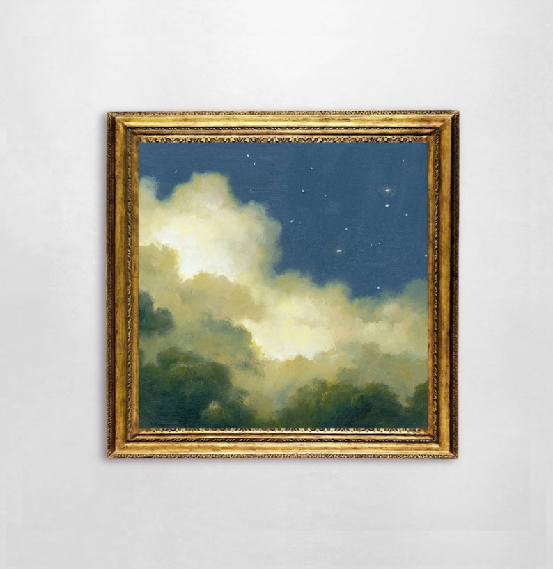 May include: A framed painting of a night sky with clouds and stars. The clouds are a light yellow and white, and the sky is a dark blue. The painting is in a gold frame.
