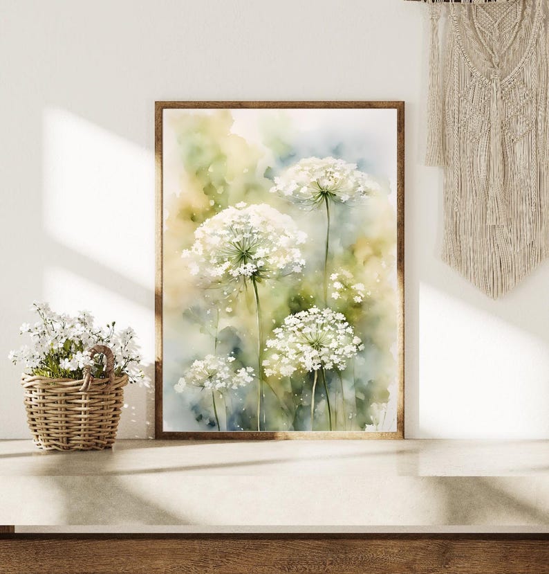 May include: Watercolour painting of white Queen Anne's Lace flowers with green stems and leaves on a light blue and yellow background.