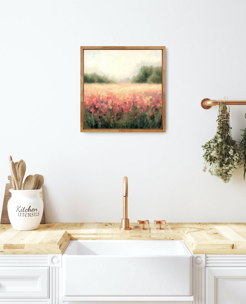 May include: A framed painting of a field of pink flowers with a blurred background of trees and a hazy sky.