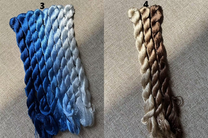 Pode incluir: Tr&ecirc;s fios de linha de bordado azul, que v&atilde;o do azul escuro ao azul claro, e tr&ecirc;s fios de linha de bordado branco, que v&atilde;o do branco ao azul claro. O fio est&aacute; disposto em uma tran&ccedil;a.