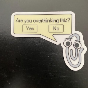 May include: A white sticker with a speech bubble that says "Are you overthinking this?" with two buttons that say "Yes" and "No". A white paperclip with googly eyes is below the speech bubble.