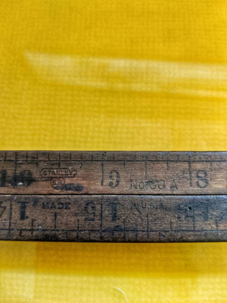 Vintage Stanley wood folding ruler number 68 A Unfolds to 24 made in USA Wood and brass.