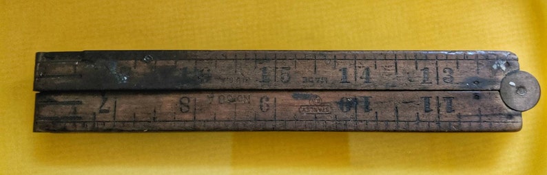 Vintage Stanley wood folding ruler number 68 A Unfolds to 24 made in USA Wood and brass.