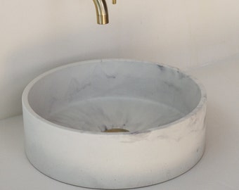Gray and white concrete sink