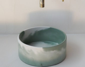 Green and white concrete hand wash basin
