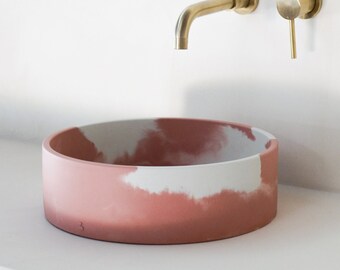 Pink and white concrete sink