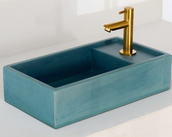 Blue concrete hand washbasin