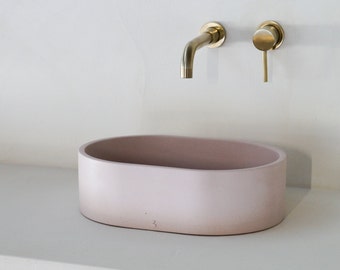 Pink oval concrete sink