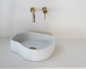 white concrete sink