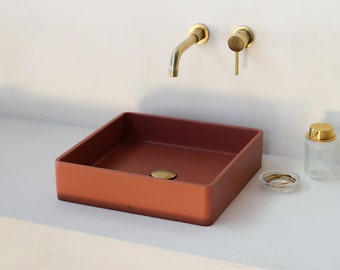 Square red concrete sink