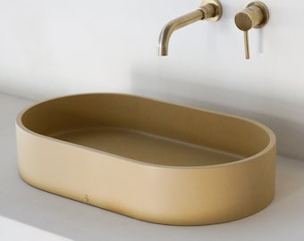 Beige oval concrete sink