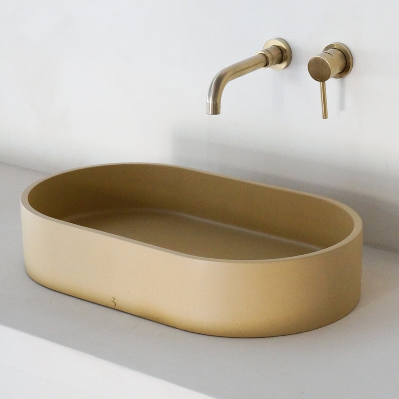 Beige oval concrete sink image 1