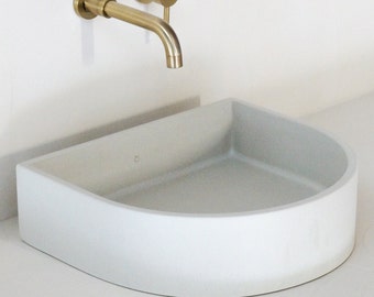 white concrete sink