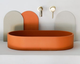 Orange oval concrete sink