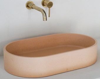 peach oval concrete sink