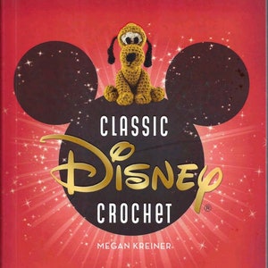 May include: A book cover with a red background and a black and white Mickey Mouse silhouette. The book title is "Classic Disney Crochet" with the Disney logo in gold. The book is by Megan Kreiner.