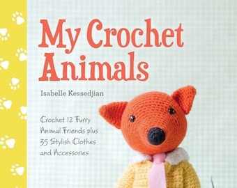 May include: A crochet book titled "My Crochet Animals" by Isabelle Kessedjian. The book cover features a crocheted fox wearing a yellow suit and pink tie. The fox is standing in front of two potted plants.