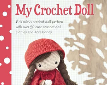 May include: A crochet doll pattern book featuring a red crocheted doll wearing a red hooded cloak and carrying a basket. The book title is "My Crochet Doll" and the text reads "A fabulous crochet doll pattern with over 50 cute crochet doll clothes and accessories".