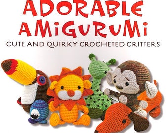 May include: A book cover featuring the title "Adorable Amigurumi" with the subtitle "Cute and Quirky Crocheted Critters." The image showcases several colorful crocheted animal figures, including a toucan, lion, and monkey.