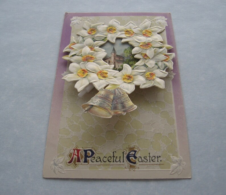 1913 A Peaceful Easter post card with additional layer cut out attached antique Easter Postcard flowers and bells addressed but unmailed