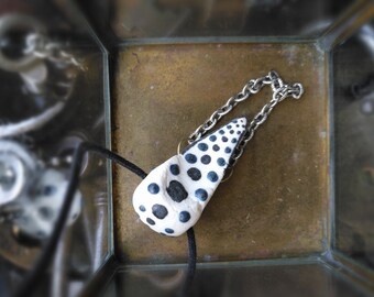 handmade ceramic abstract pendant, & chain pendant, on black cotton cord. vegan fashion. androgynous aesthetic. boho goth statement piece