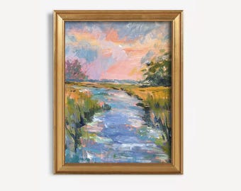 May include: An impressionistic landscape painting in a gold frame. The artwork depicts a river or marsh scene with colorful brushstrokes in shades of blue, green, yellow, pink, and orange. The sky is a mix of pink and blue.
