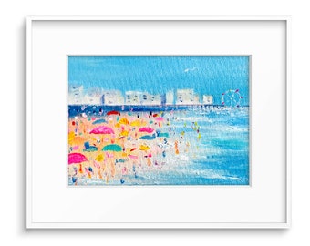 May include: A painting of a beach scene with colorful umbrellas and people on the sand. In the background, there are buildings and a Ferris wheel.